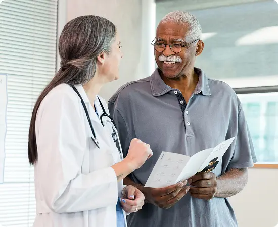 A practitioner meets with a male patient.